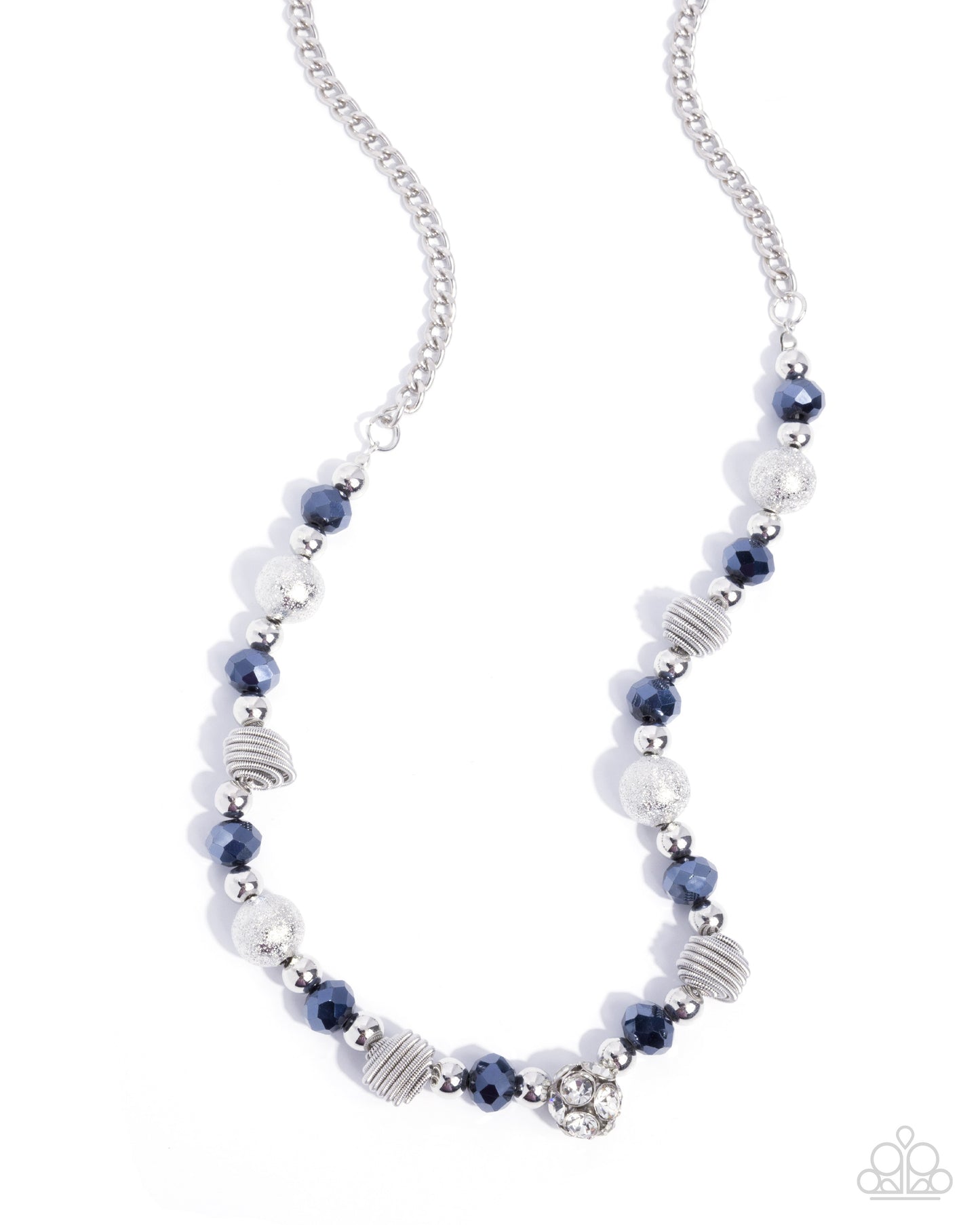 A silver beaded necklace featuring faceted navy blue beads, textured silver spiral discs, and clear crystal accents, displayed on a clean white background.