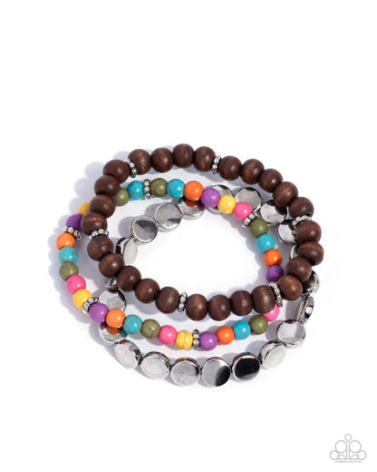 Stack of colorful beaded bracelets on a white background
