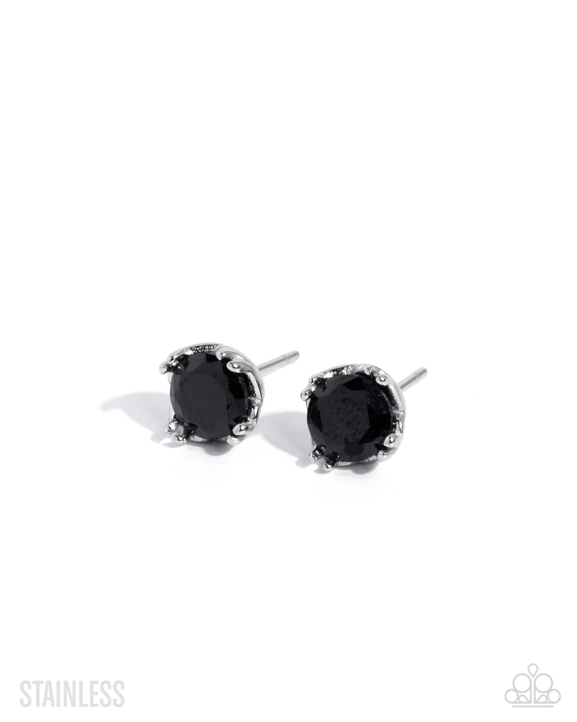 Set of silver earrings on a white background