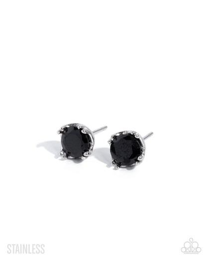 Set of silver earrings on a white background