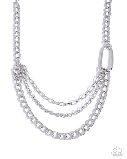 Silver chain necklace on a white background