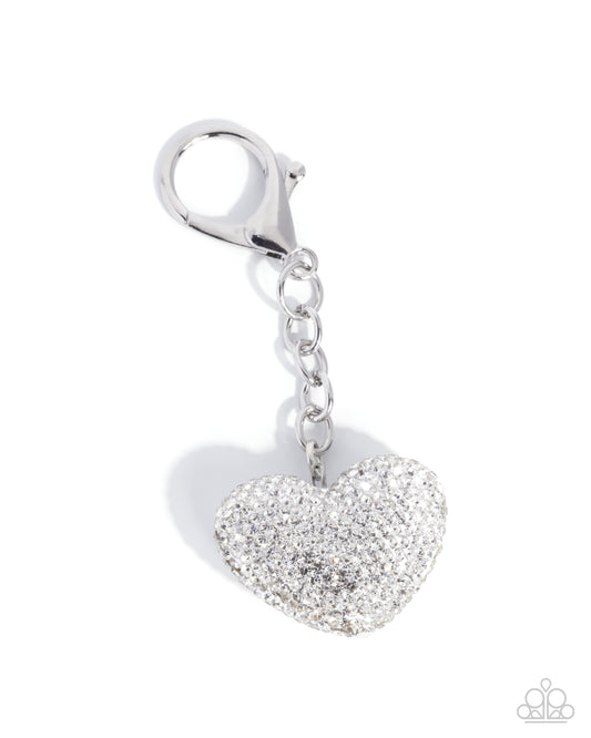 Silver heart-shaped keychain with clear stones on a white background