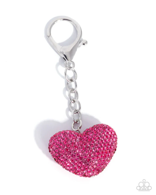 Pink heart-shaped keychain charm with silver clasp on a white background