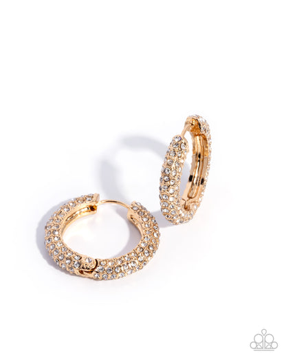Gold hoop earrings with gemstones on a white background