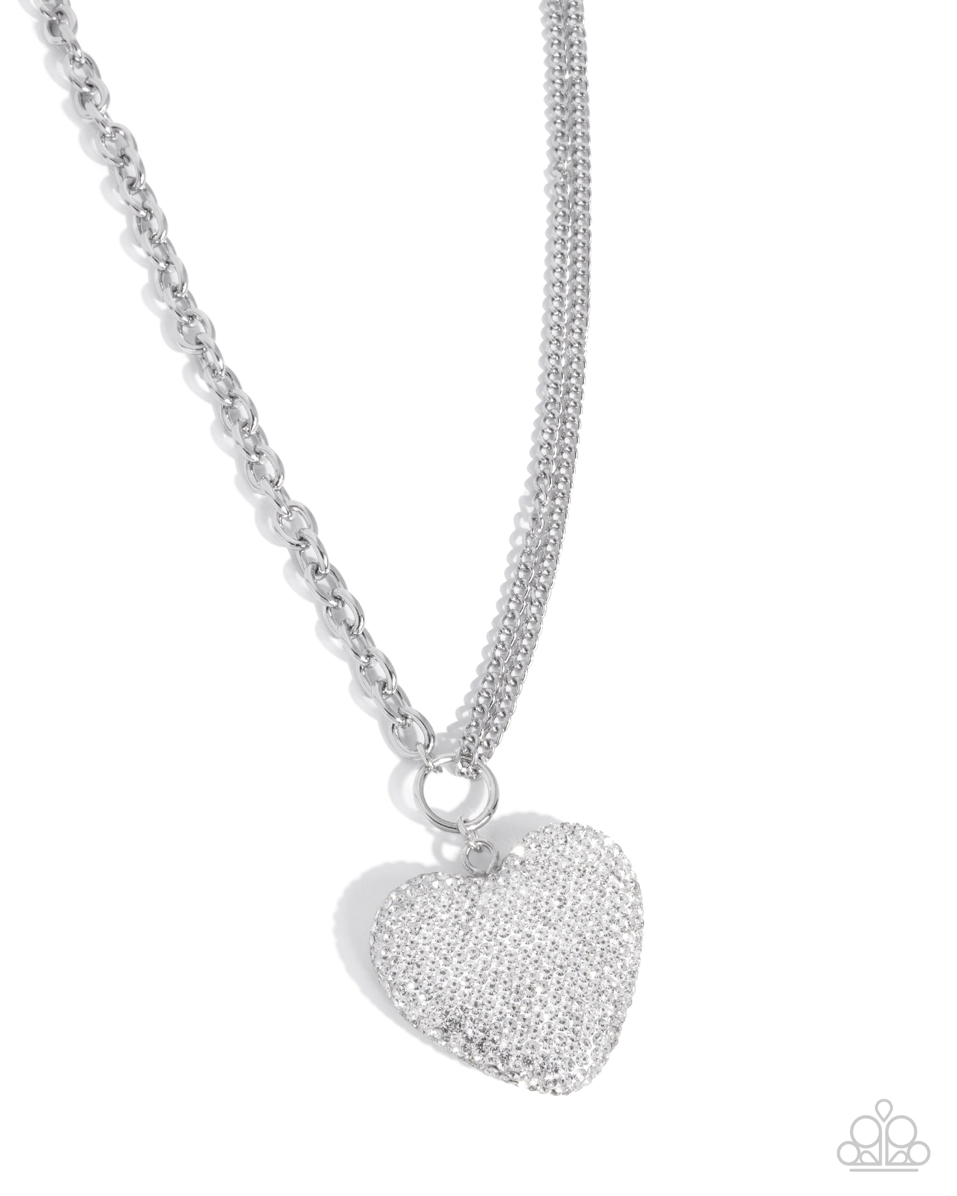 Silver heart-shaped pendant on a chain against a white background