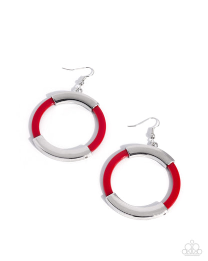 Pair of red and silver hoop earrings on a white background