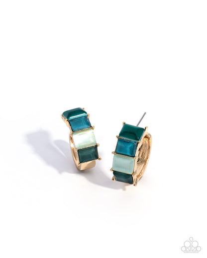 Pair of gold hoop earrings with green and light blue square stones on a white background