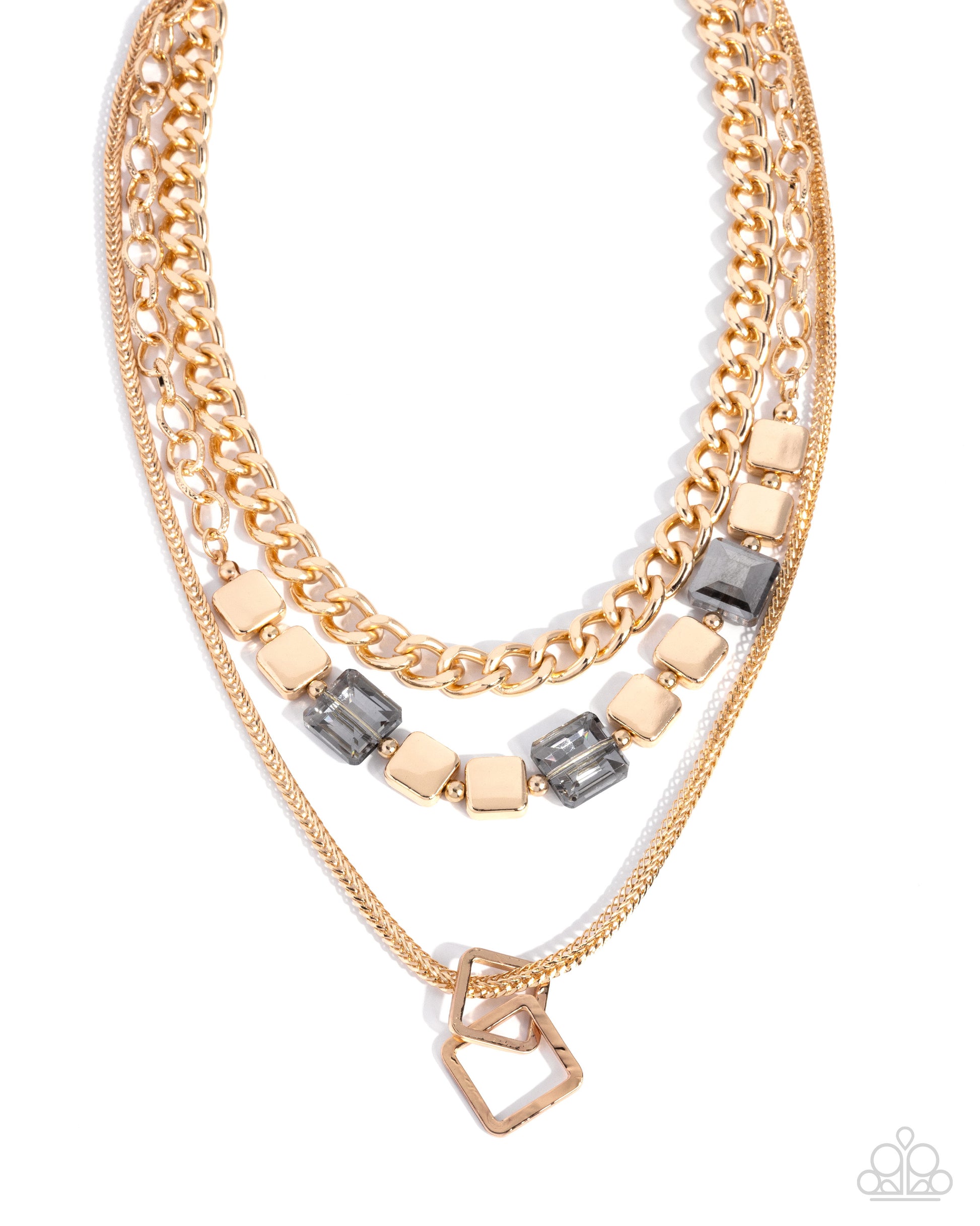 A layered gold-tone necklace featuring a chunky curb chain, a delicate chain, and a middle chain accented with square gold beads and dark gray rectangular crystals, finished with a geometric interlocking pendant.