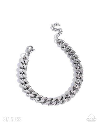 Silver chain bracelet on a white background