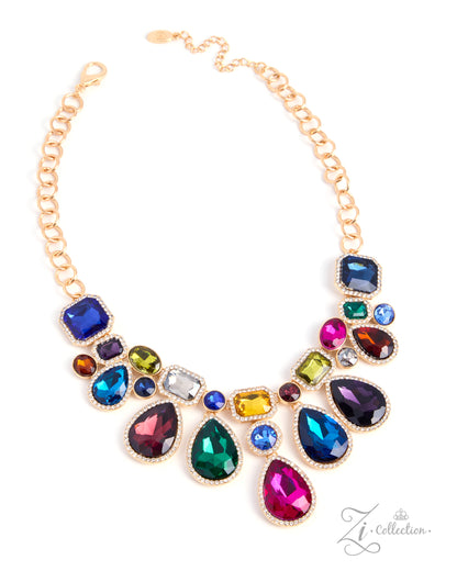 A gold-tone chain necklace with a wide bib-style arrangement of multicolored faceted rhinestones in various shapes, including teardrops, squares, and round stones, shown on a plain white background.