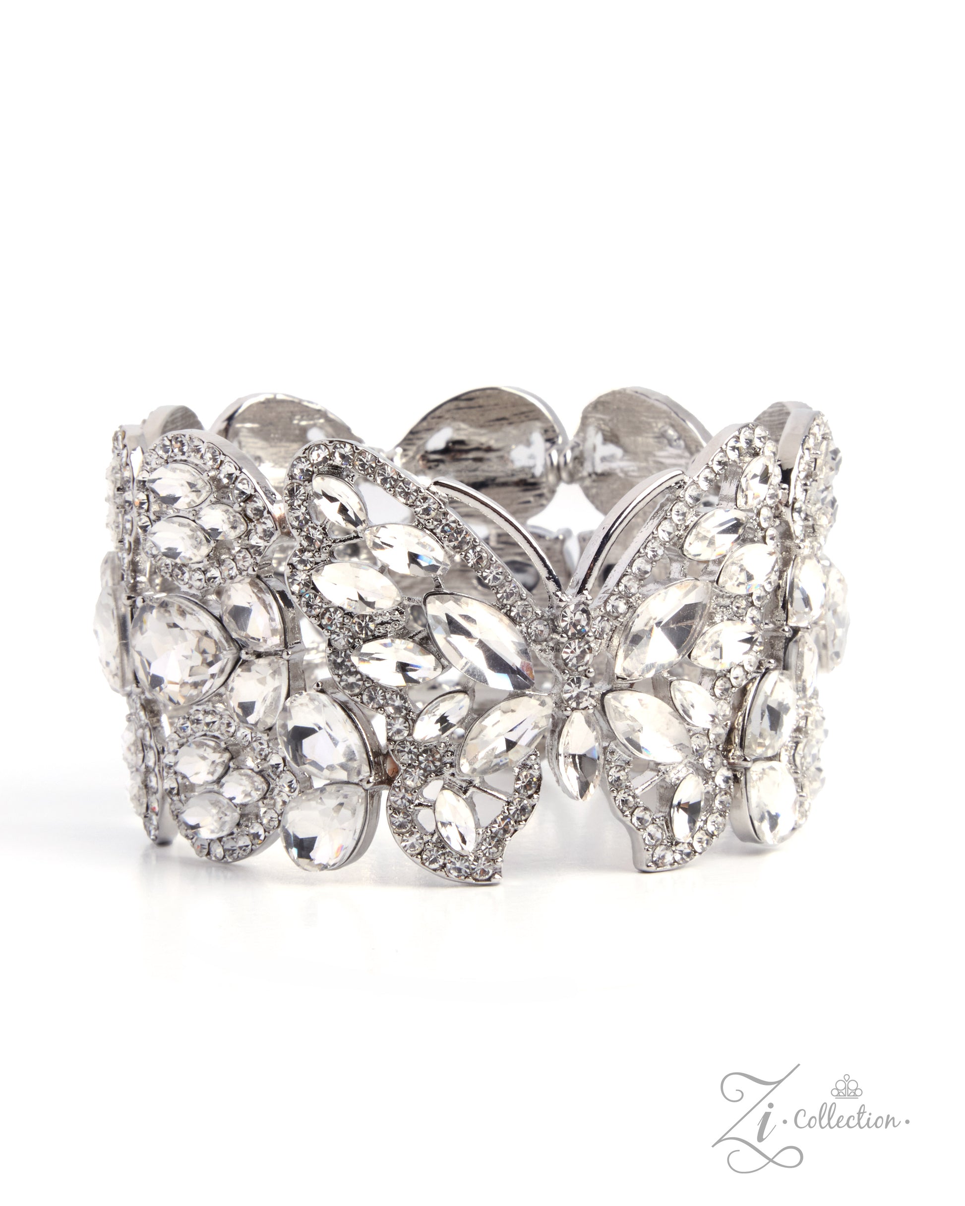 A wide silver-tone cuff bracelet adorned with clear marquise and round crystals, arranged in a symmetrical floral and butterfly motif, shown on a white background.