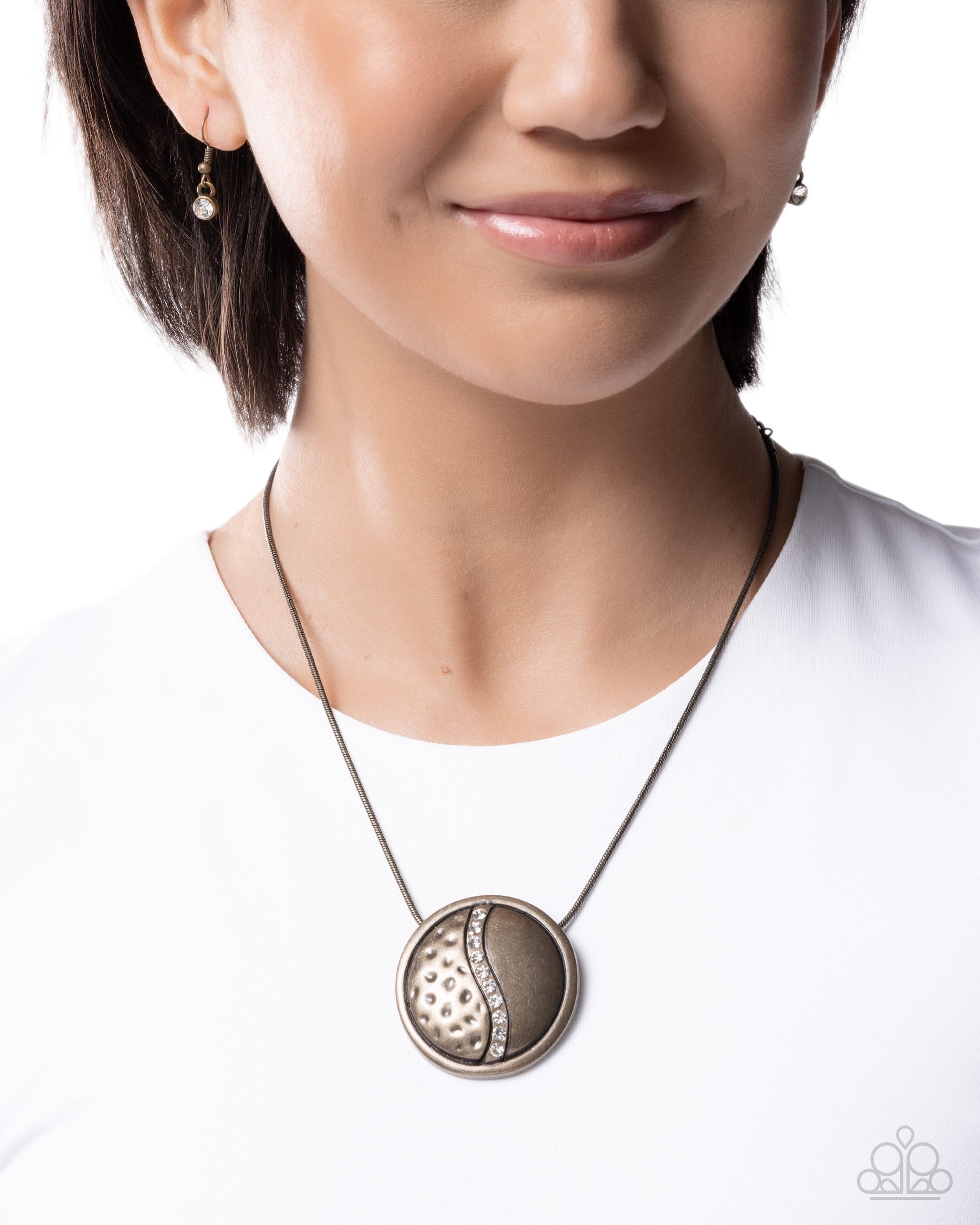 Close-up of a woman wearing a necklace with a white background