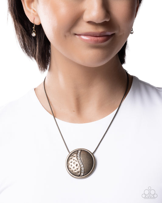 Close-up of a woman wearing a necklace with a white background