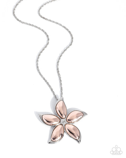 Floral pendant necklace with rose gold accents on a white background