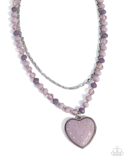 Necklace with heart-shaped pendant and purple beads on a white background
