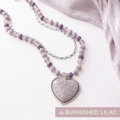 Necklace with a heart-shaped pendant on a white background, labeled 'Burnished Lilac'.