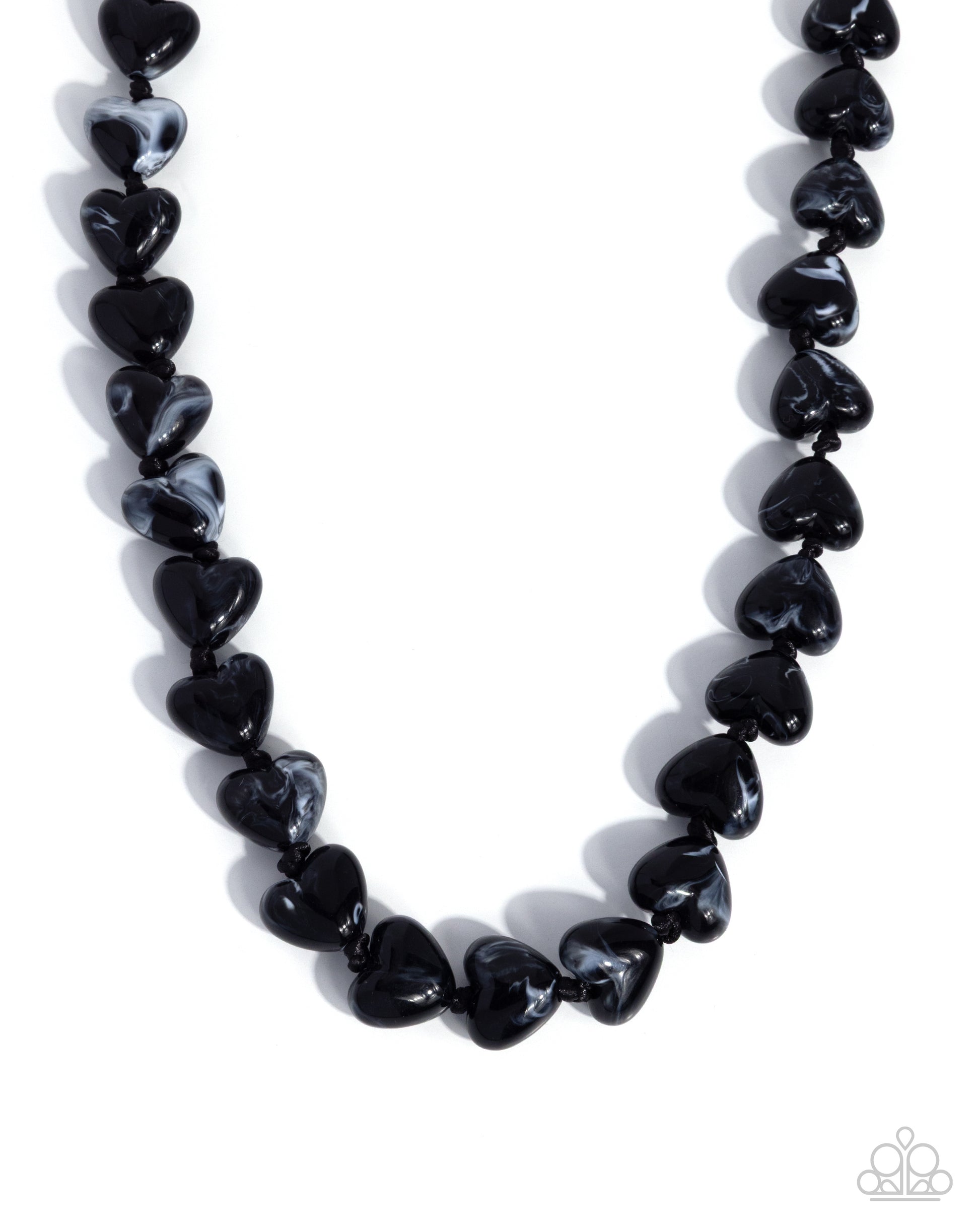 Necklace with black heart-shaped beads on a white background