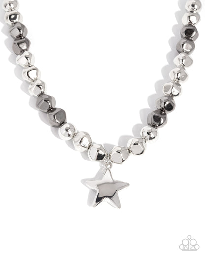 Silver beaded necklace with a star pendant on a white background