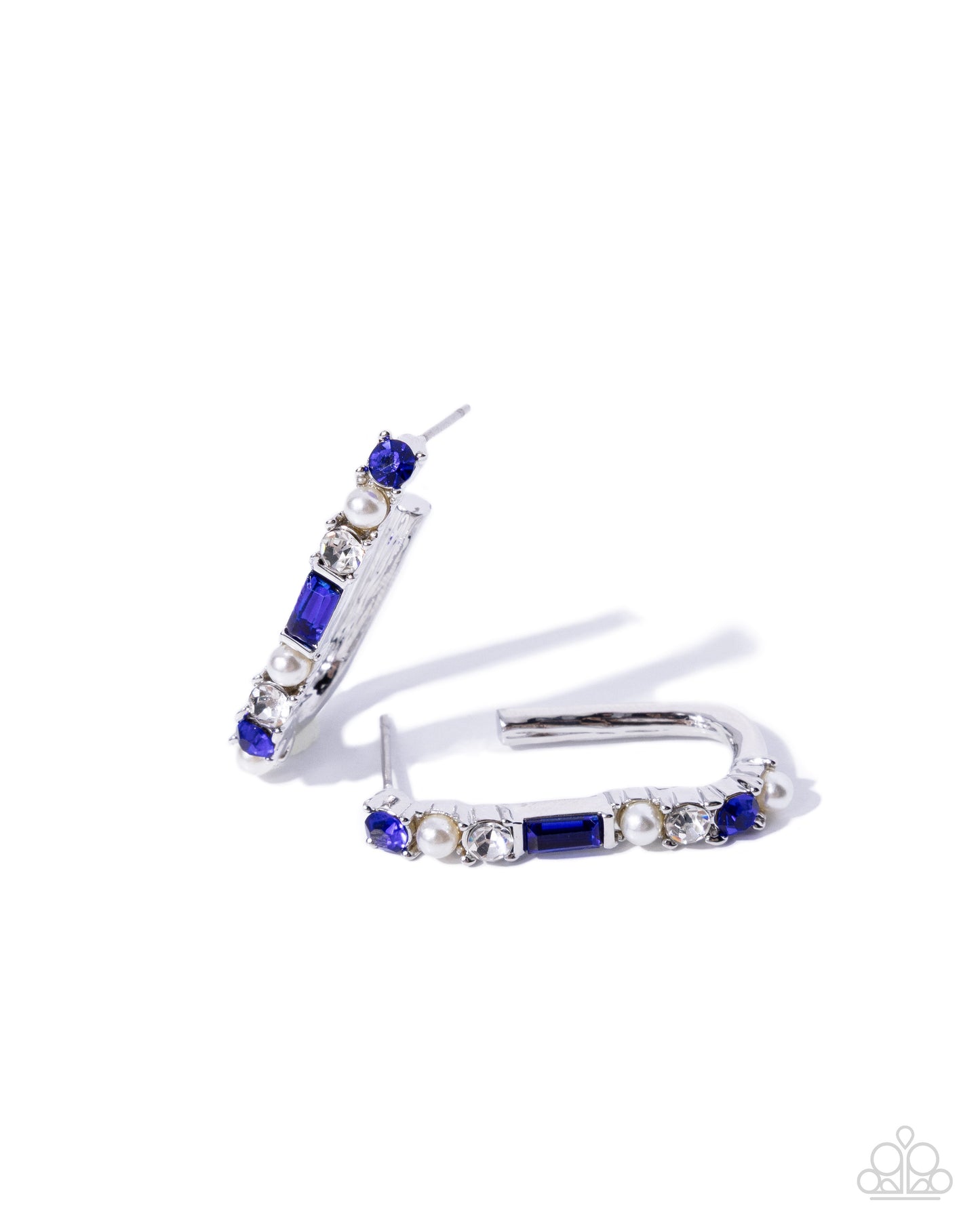 Pair of hoop earrings with blue and clear gemstones on a white background