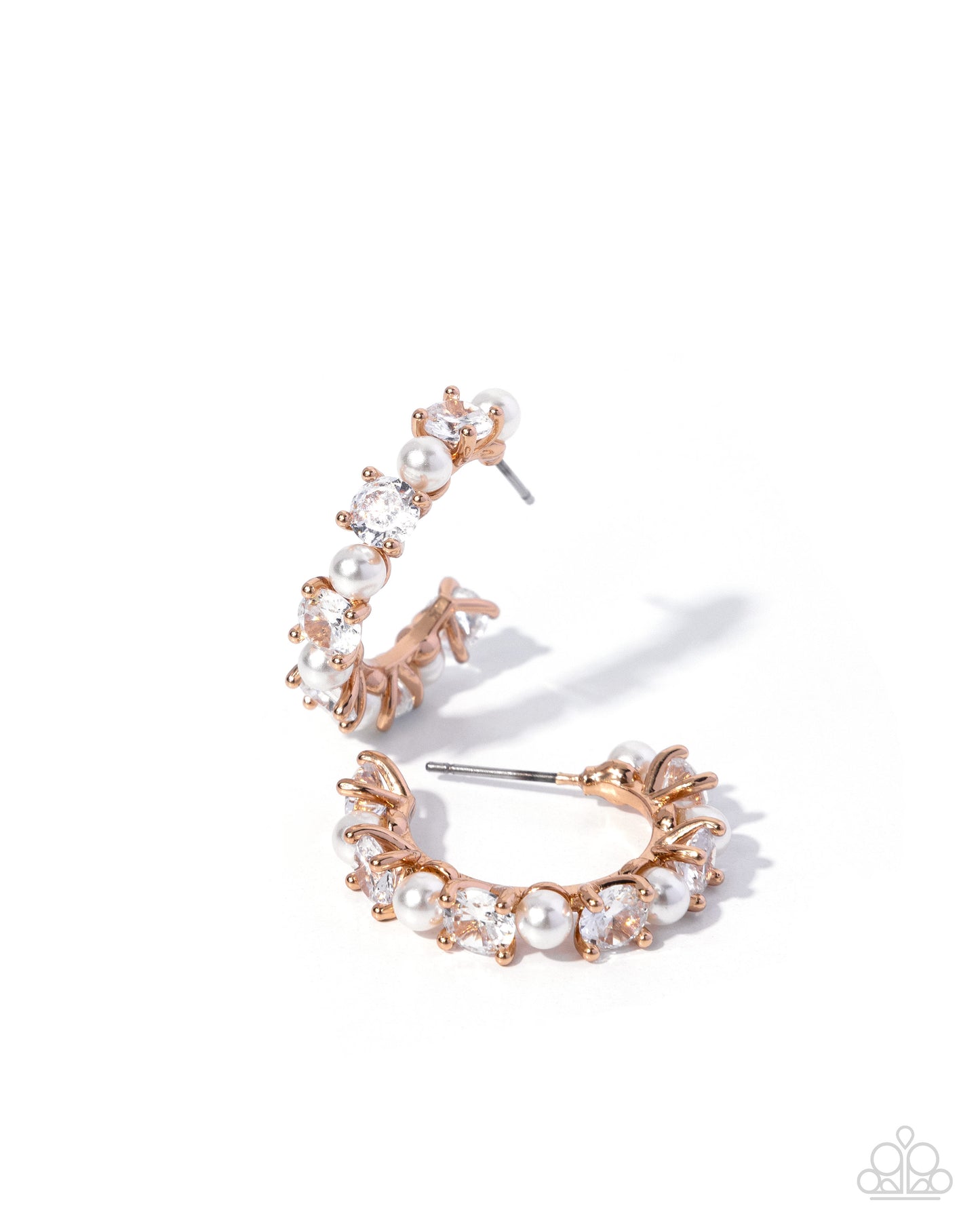 Rose gold hoop earrings with pearls on a white background