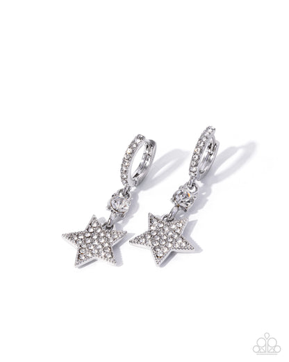 Star-shaped earrings with rhinestones on a white background