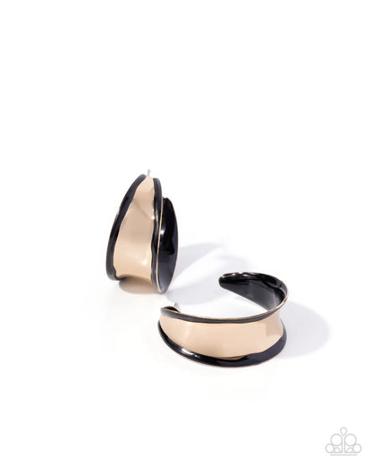 Pair of gold and black hoop earrings on a white background