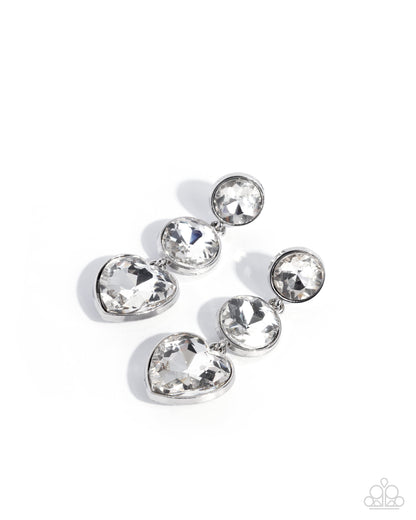Silver earring with clear gemstones on a white background