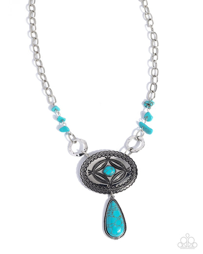 Necklace with silver chain, turquoise beads, and a central pendant on a white background
