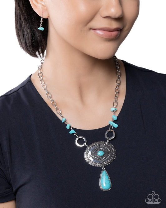 Necklace with turquoise stones worn by a person on a white background