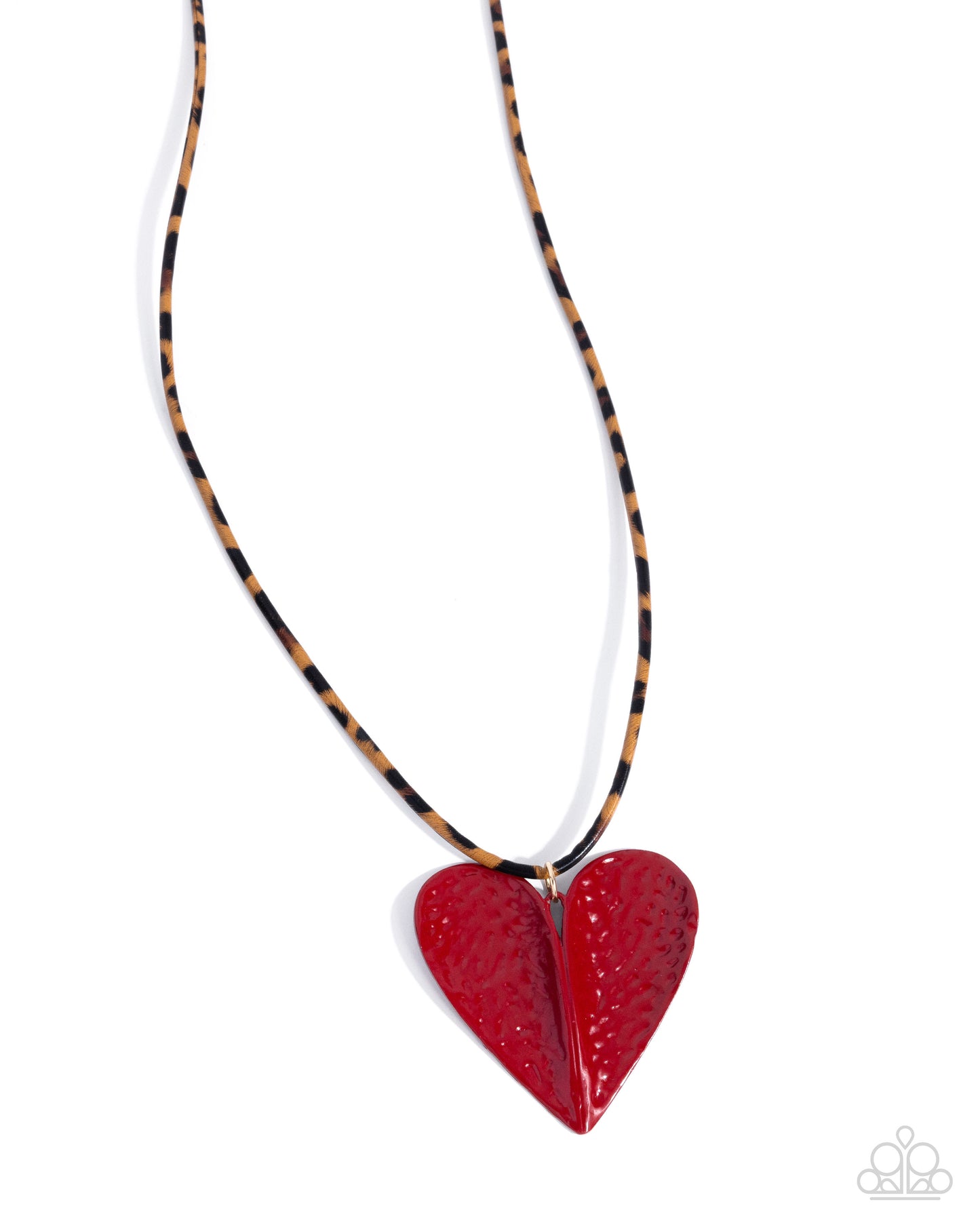 Red heart-shaped pendant on a black and gold cord against a white background