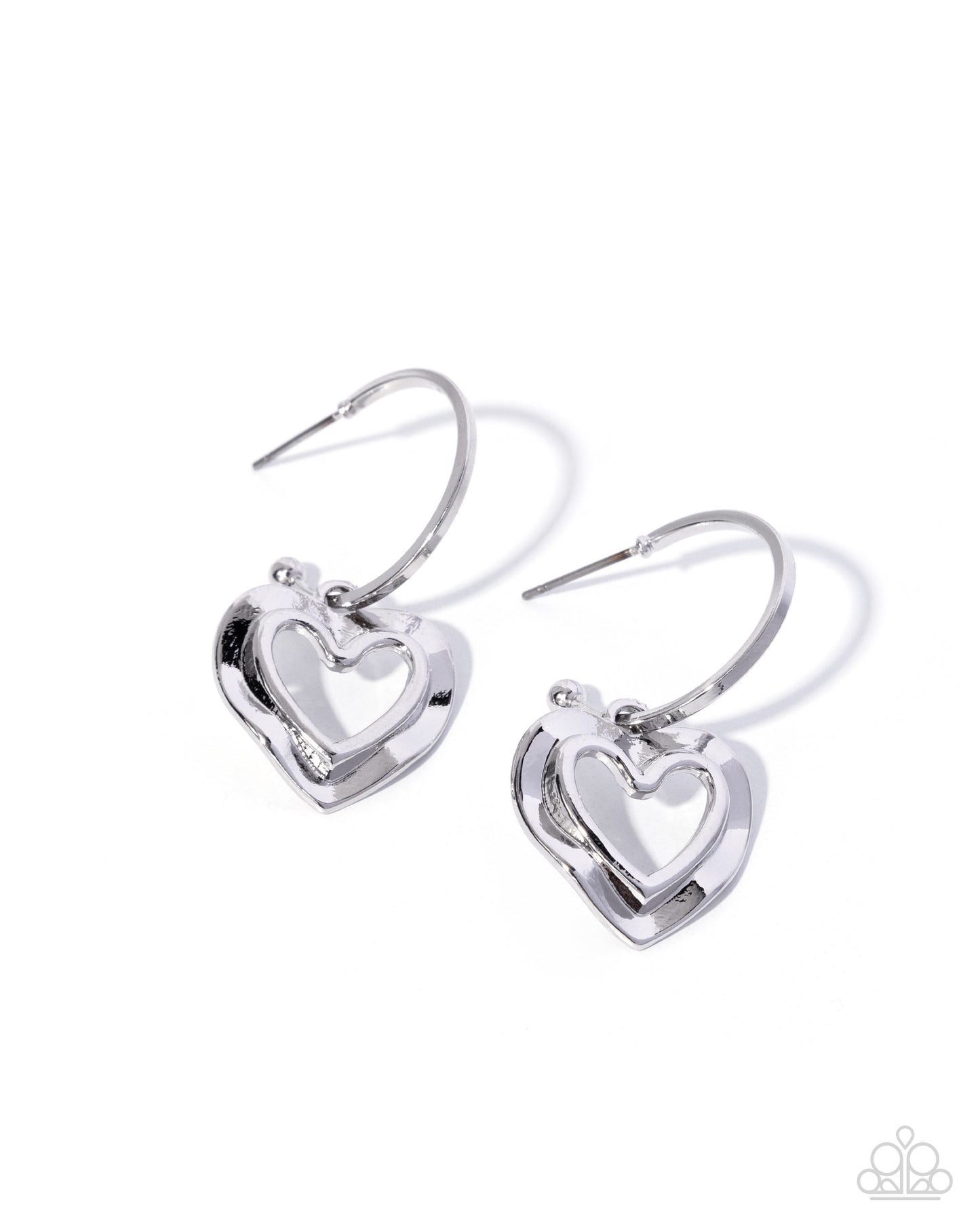 Pair of silver heart-shaped earrings on a white background