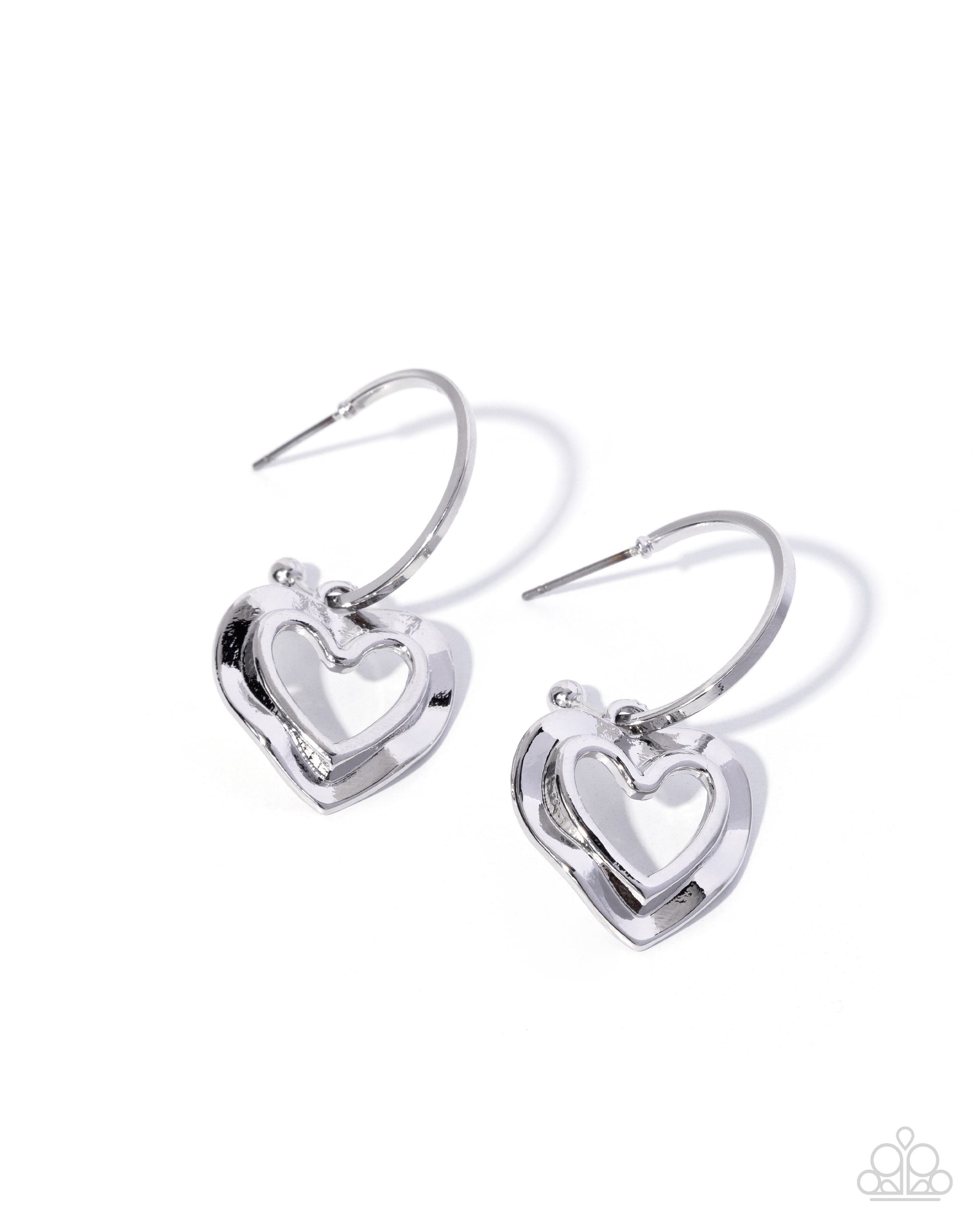 Pair of silver heart-shaped earrings on a white background