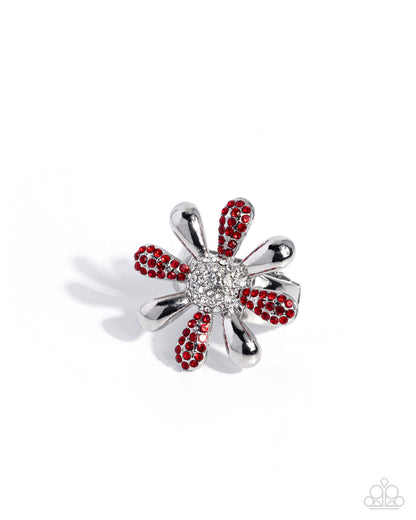Silver brooch with red gemstones on a white background