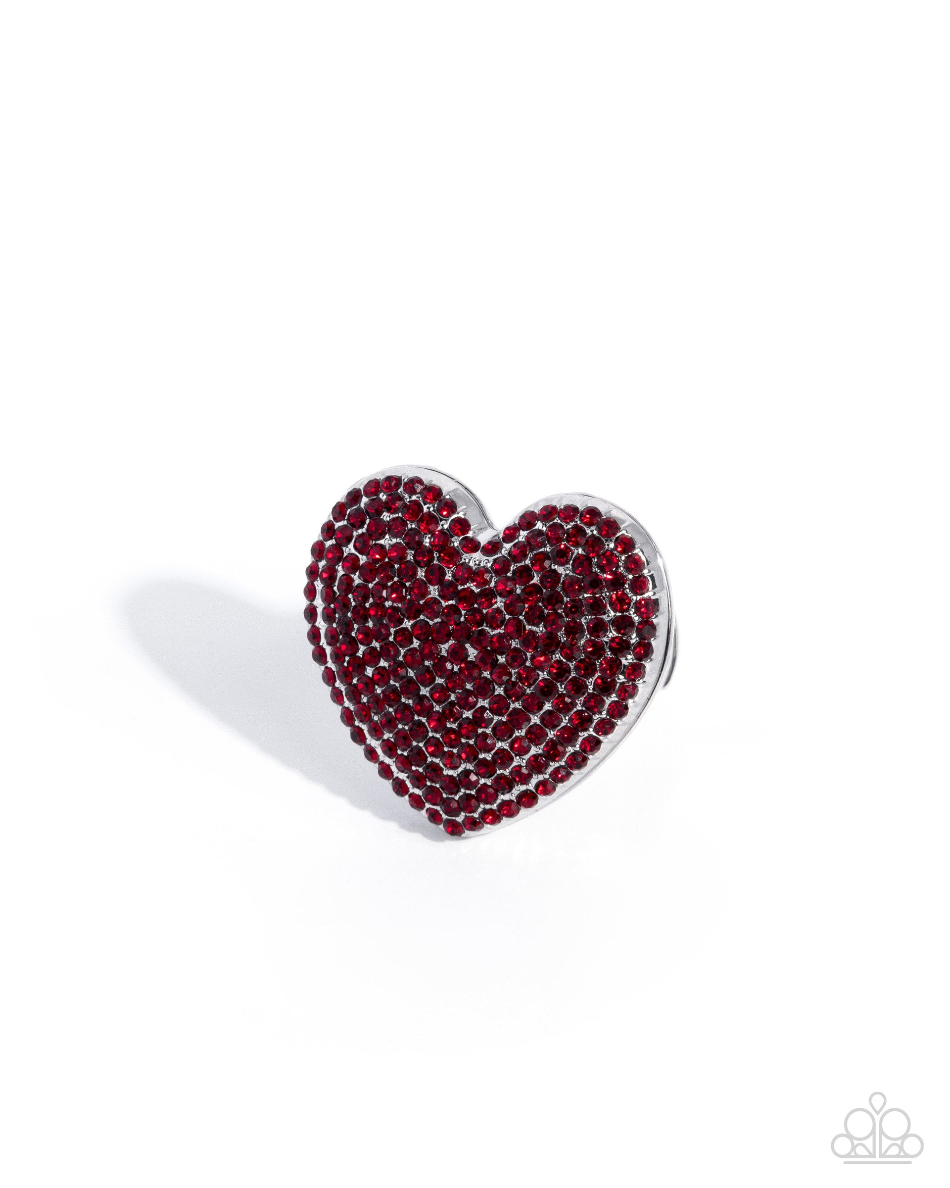 Heart-shaped brooch with red gemstones on a white background