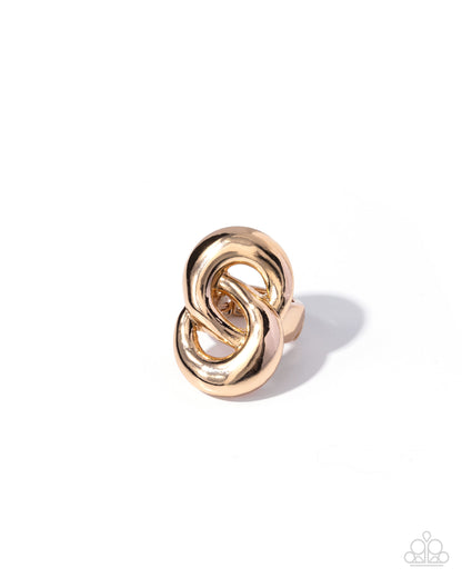 Gold knot-shaped earring on a white background
