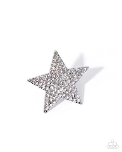 Star-shaped earring with clear stones on a white background