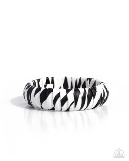 Black and white zebra-patterned bracelet on a white background