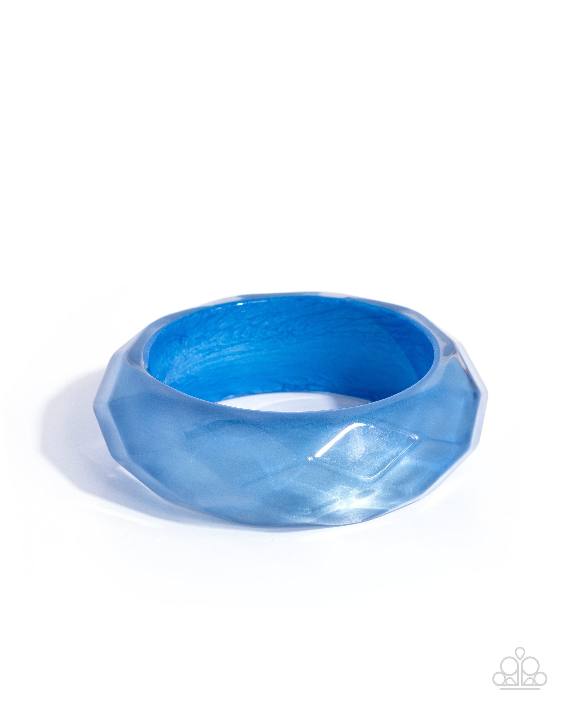 Blue ring with a textured surface on a white background