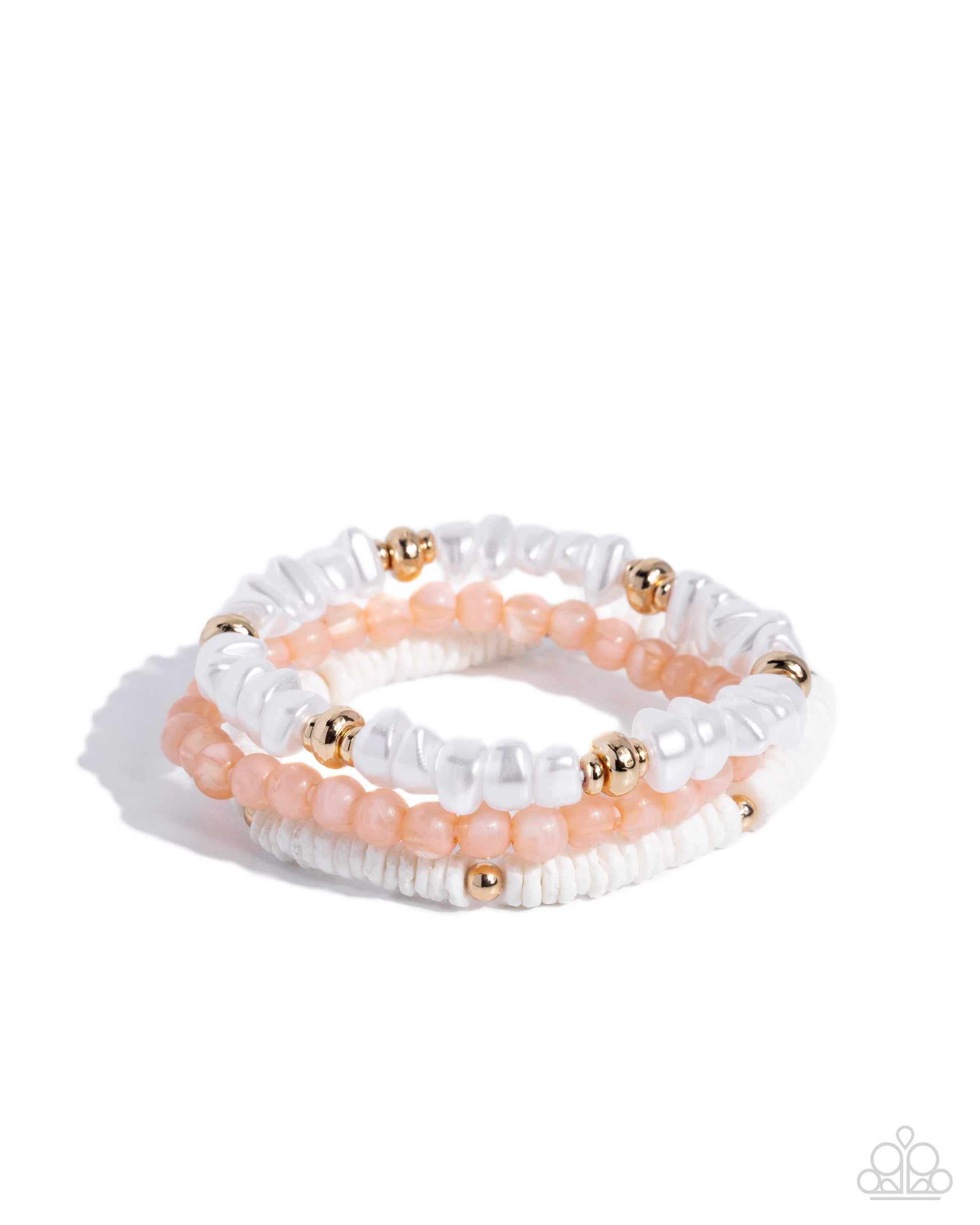 Set of white and peach beaded bracelets with gold accents on a white background