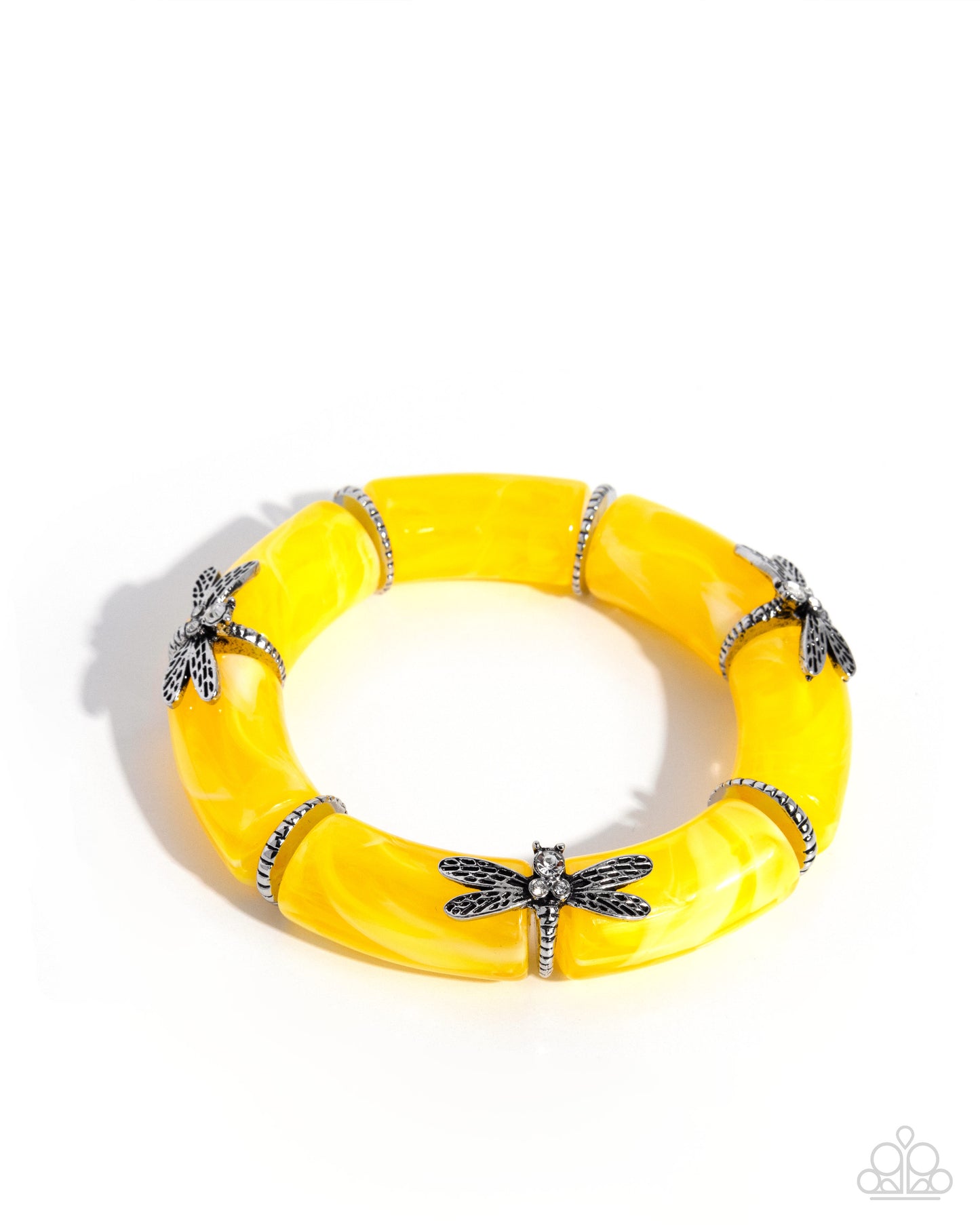 Yellow bracelet with dragonfly charms on a white background