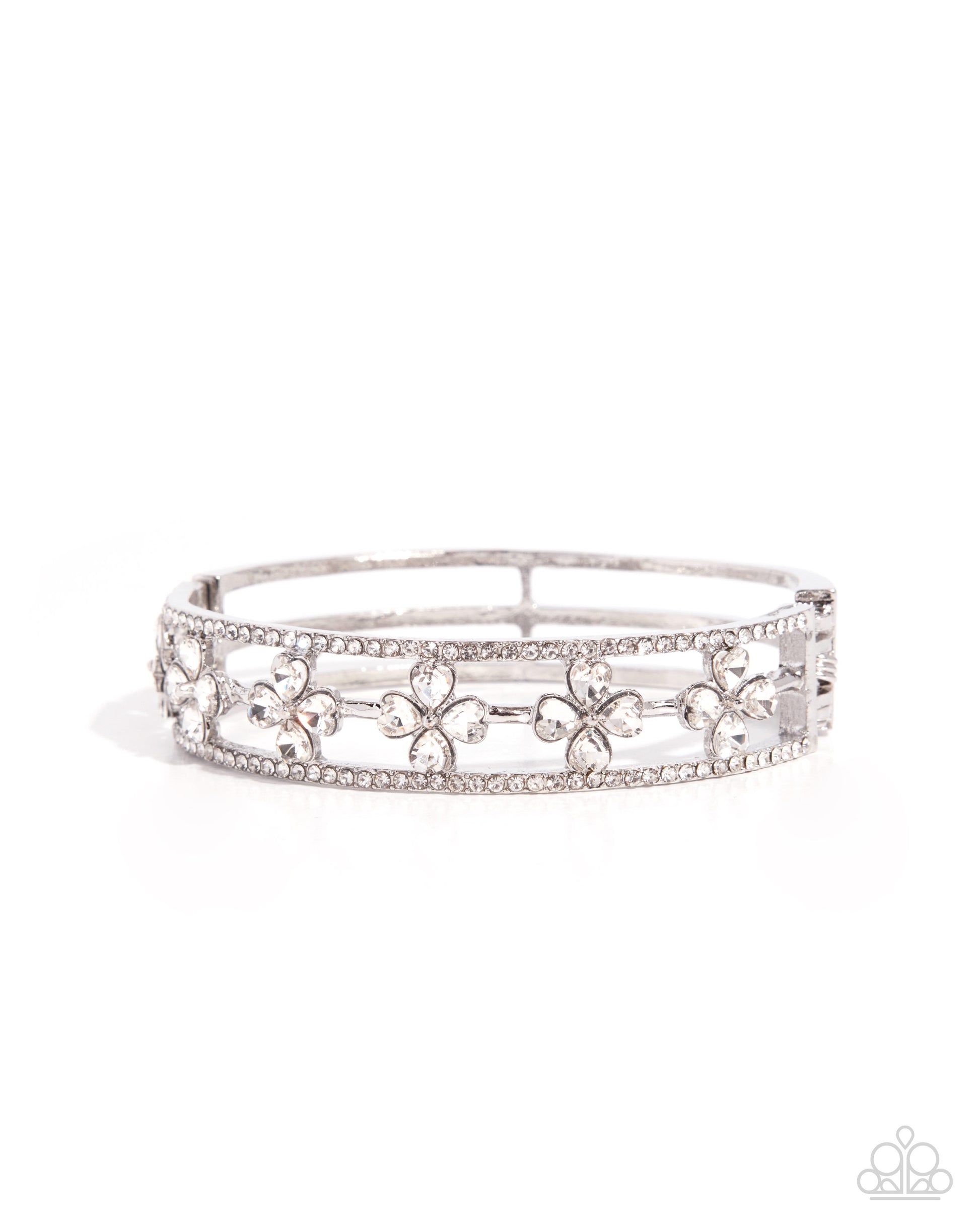 Silver tiara with floral designs on a white background