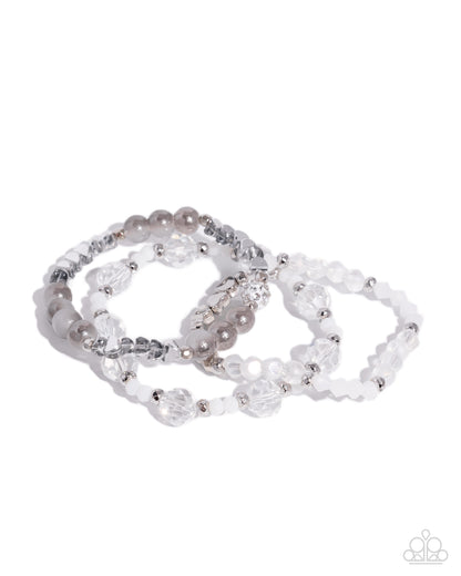 Set of beaded bracelets on a white background