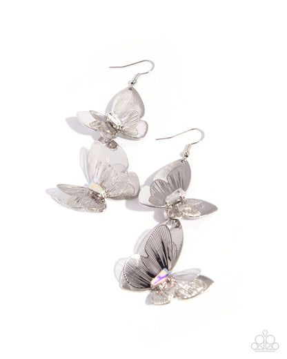 Butterfly-shaped earrings on a white background