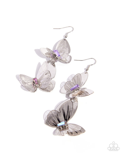 Butterfly-shaped earrings with silver and purple accents on a white background