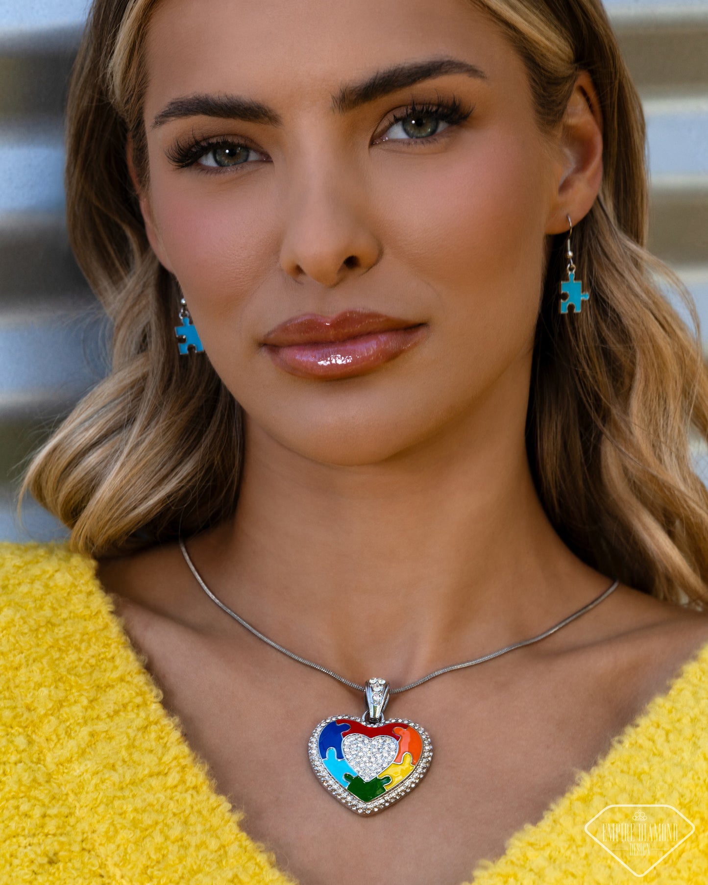 Model wearing Puzzling Parallel multicolor heart necklace