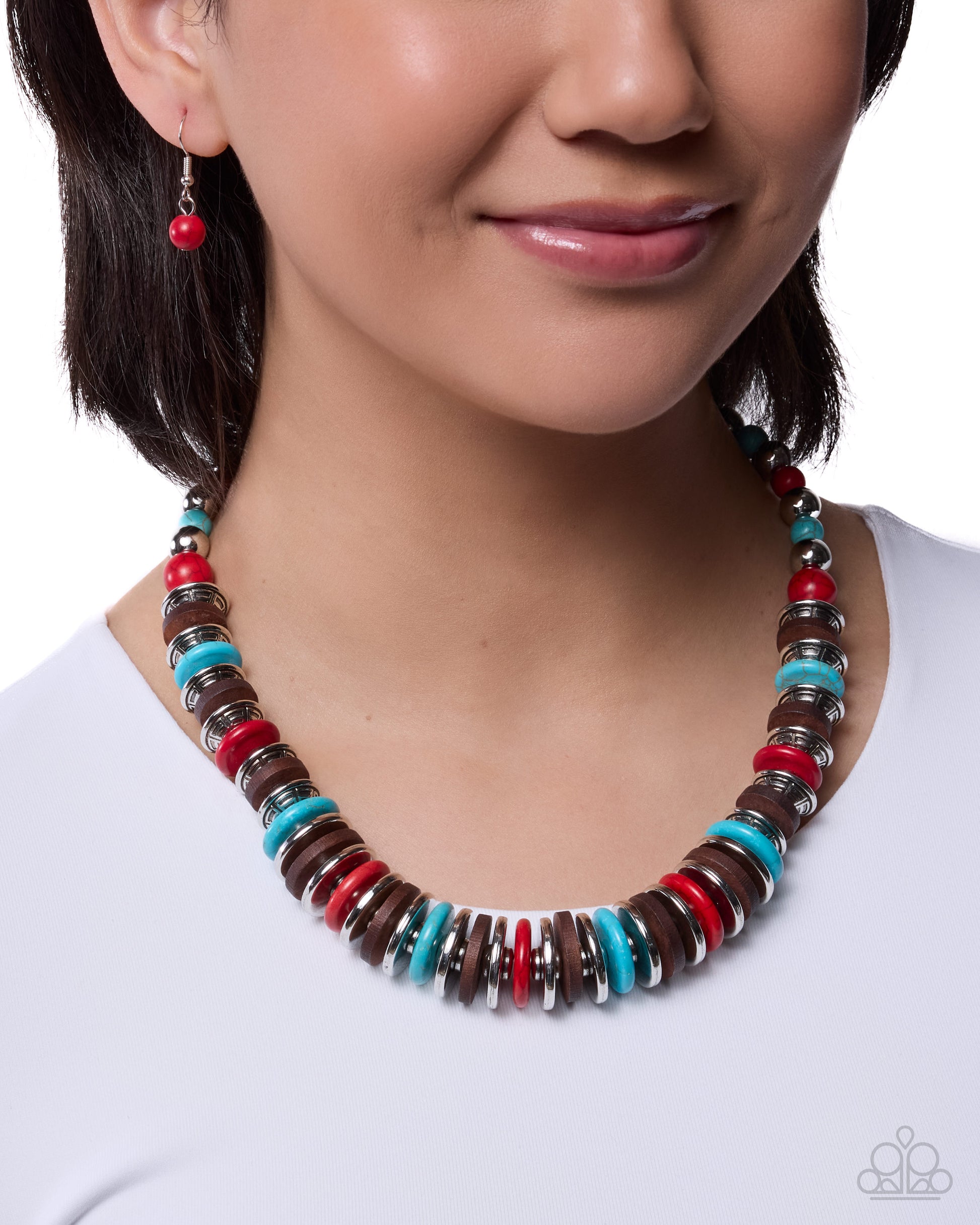 Necklace with multicolored beads worn by a model on a white background