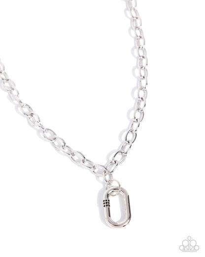 Silver chain necklace with a unique pendant on a white background