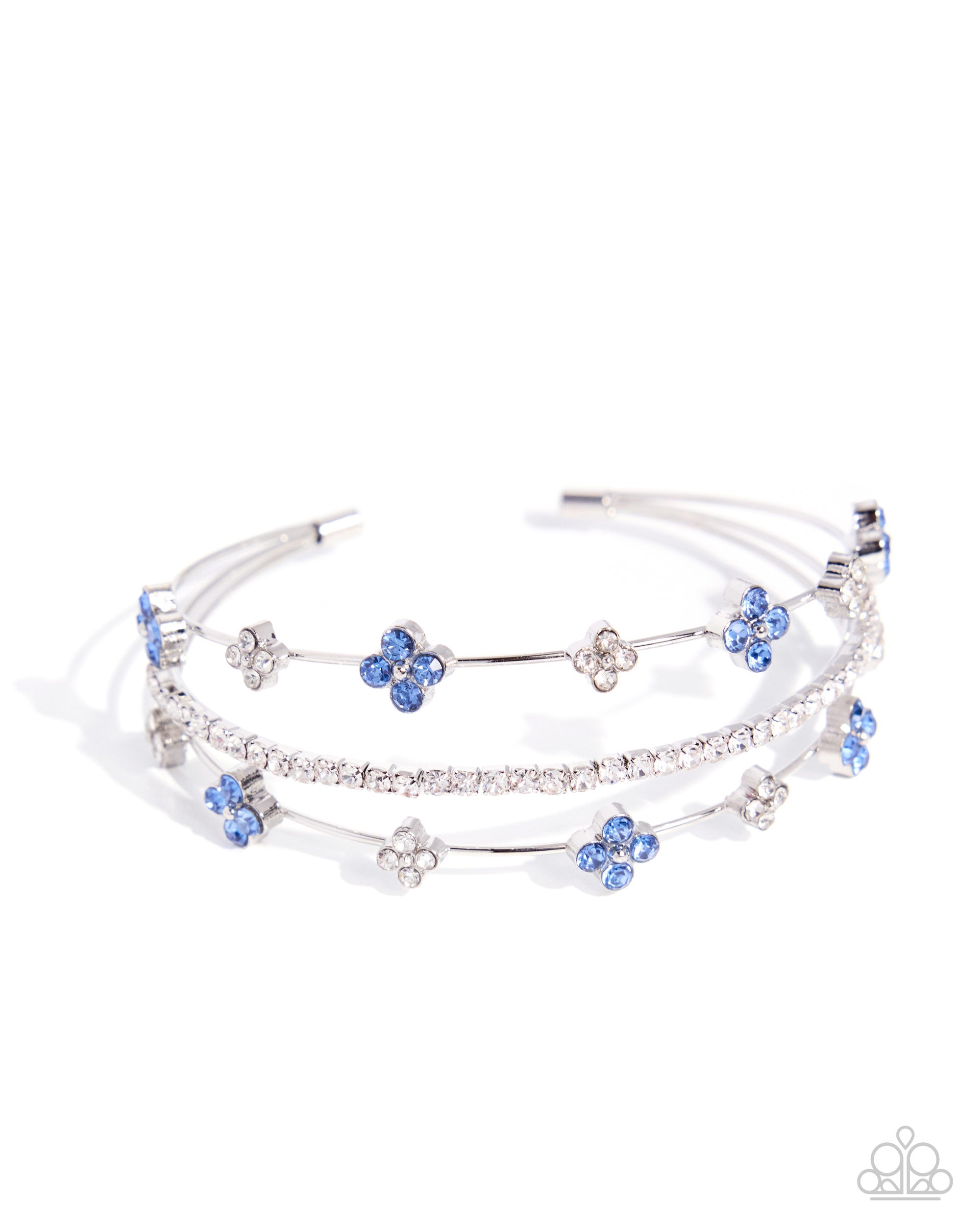 Multi-layered bracelet with blue flower charms on a white background