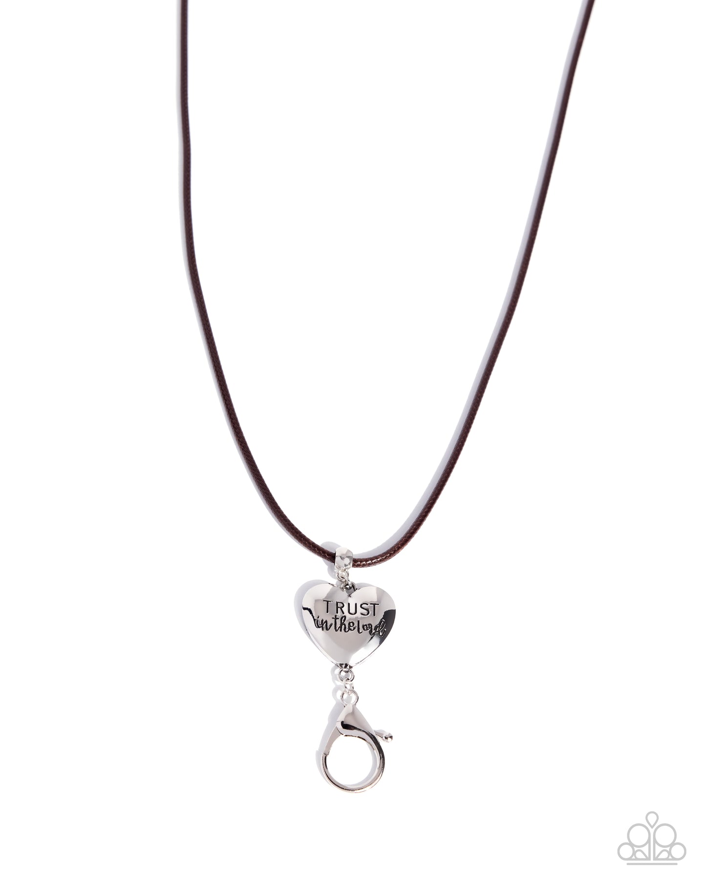 A silver heart-shaped pendant engraved with 'TRUST in Jesus' hanging from a dark brown cord necklace on a white background.