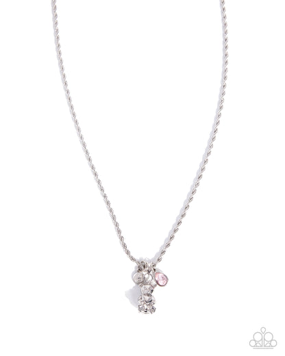Necklace with small charms on a white background